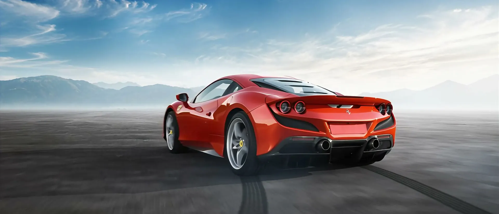 APEX GT — the scarlet concept drifting low across an open flat in the night-run finale
